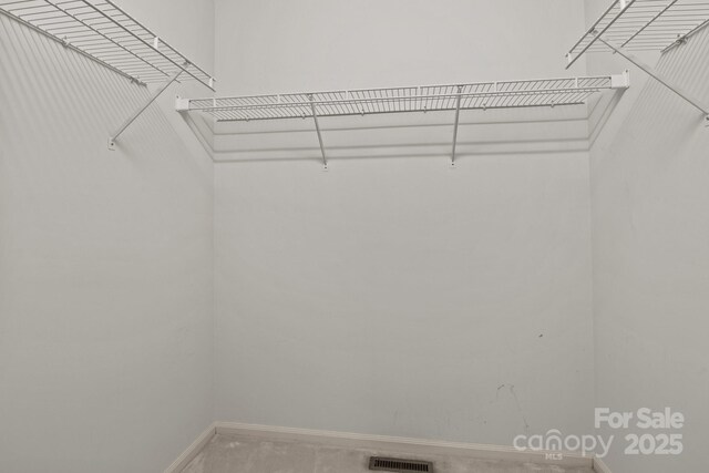 walk in closet with visible vents
