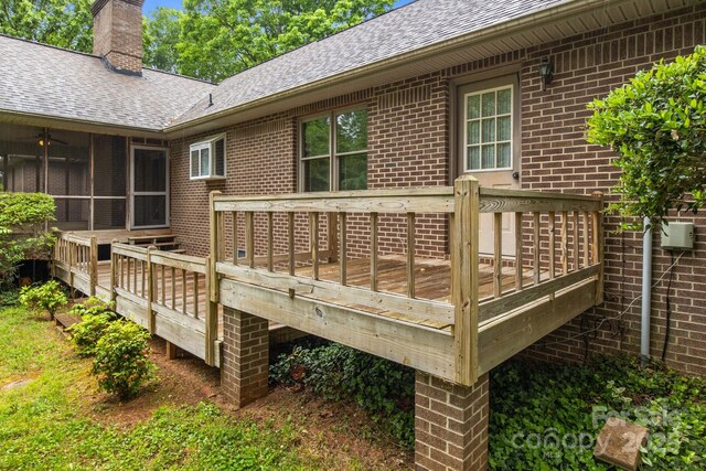 deck with a sunroom