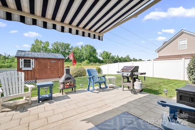 18027 Train Station Dr, Cornelius, NC 28031 - view of patio / terrace with a storage shed, fence, an outdoor structure, and a grill