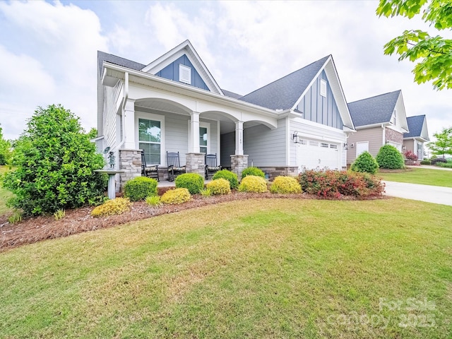 1149 Mayapple Way, Belmont, NC 28012 - craftsman-style house with board and batten siding, covered porch, a garage, driveway, and a front yard