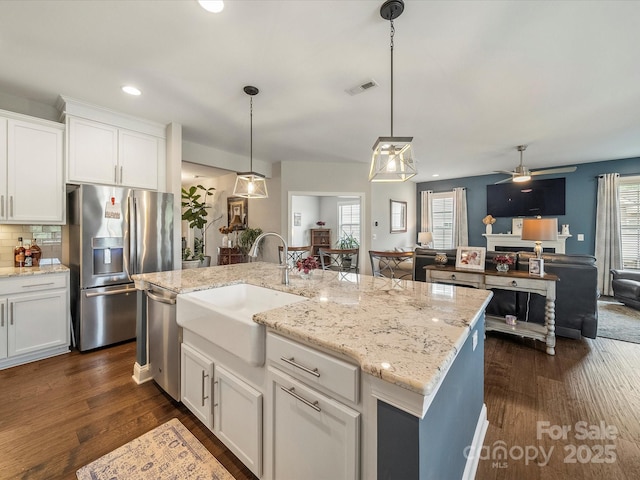 1149 Mayapple Way, Belmont, NC 28012 - kitchen with white cabinetry, a sink, appliances with stainless steel finishes, visible vents, and open floor plan