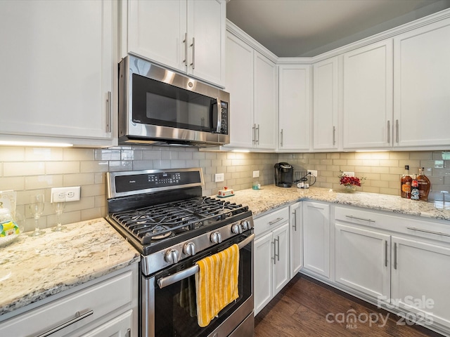 1149 Mayapple Way, Belmont, NC 28012 - kitchen featuring white cabinetry, tasteful backsplash, light stone countertops, and appliances with stainless steel finishes