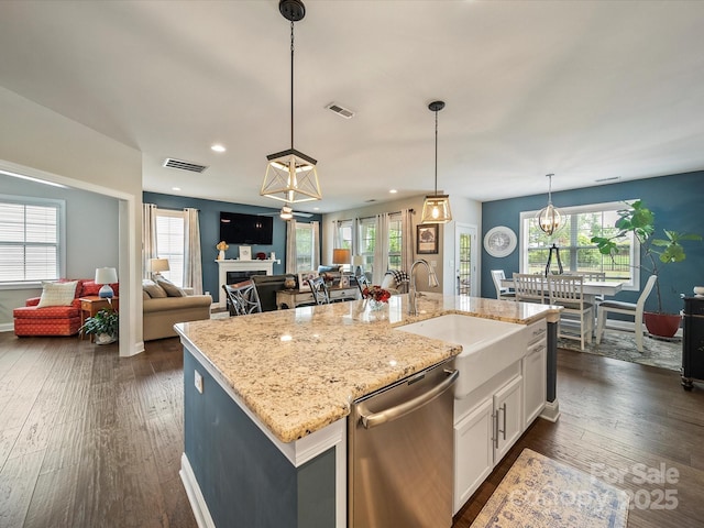 1149 Mayapple Way, Belmont, NC 28012 - kitchen featuring white cabinets, dishwasher, a sink, open floor plan, and dark wood-type flooring