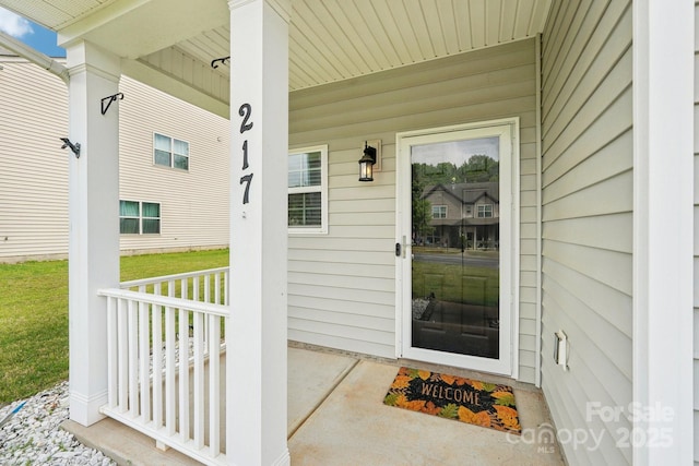 property entrance featuring covered porch