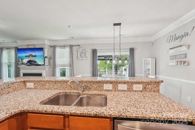 kitchen with open floor plan, dishwasher, crown molding, and a sink