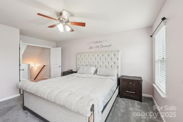 bedroom with ceiling fan, carpet floors, and baseboards