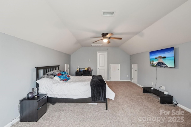 bedroom featuring visible vents, vaulted ceiling, carpet, and baseboards