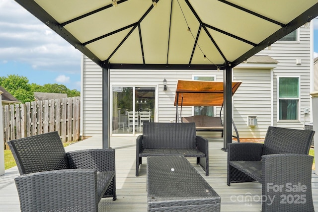 wooden terrace featuring fence