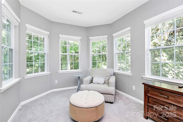 sunroom / solarium with visible vents and a healthy amount of sunlight