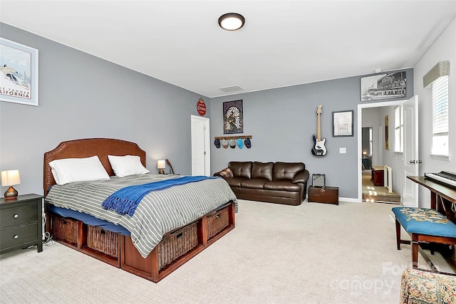 bedroom with carpet flooring, baseboards, and visible vents