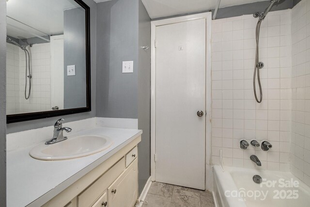 full bathroom featuring washtub / shower combination and vanity