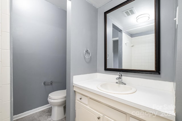 full bath with vanity, a shower, toilet, baseboards, and tile patterned floors