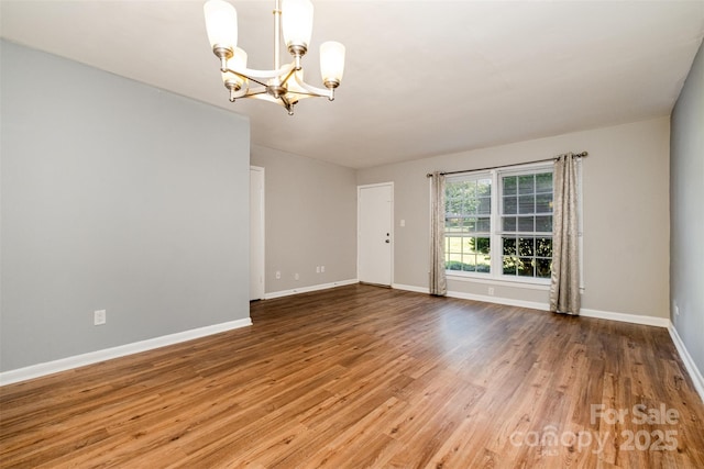 4609 Coronado Dr Unit N, Charlotte, NC 28212 - empty room with a chandelier, wood finished floors, and baseboards