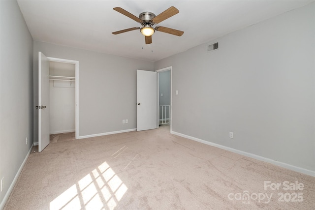 4609 Coronado Dr Unit N, Charlotte, NC 28212 - unfurnished bedroom featuring light colored carpet, baseboards, a ceiling fan, and a closet