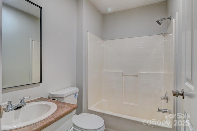 bathroom featuring vanity, toilet, and bathtub / shower combination