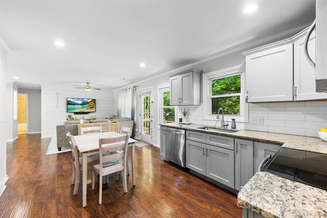kitchen with a ceiling fan, dishwasher, a sink, gray cabinetry, and ornamental molding