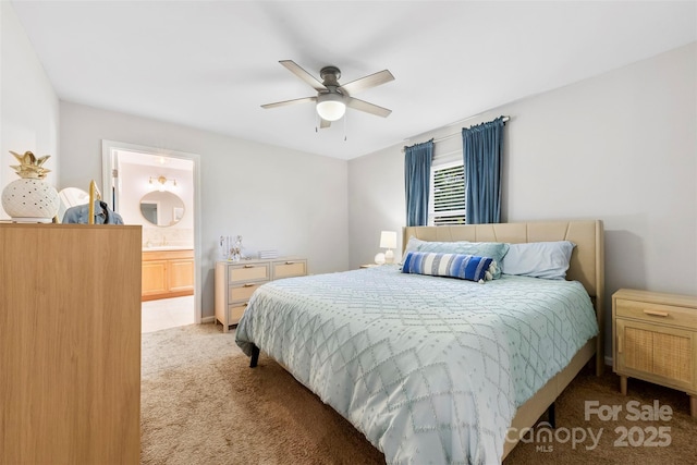bedroom featuring light colored carpet, connected bathroom, and ceiling fan