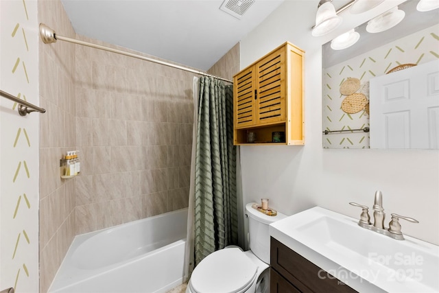 full bath with visible vents, shower / bath combo, toilet, and vanity