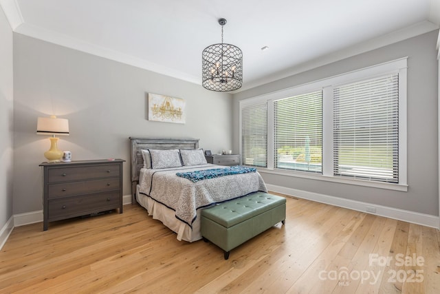 bedroom with baseboards and light wood-type flooring