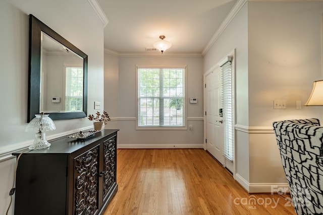 13360 Old Compton Ct, Pineville, NC 28134 - entrance foyer with baseboards, ornamental molding, and light wood-style flooring
