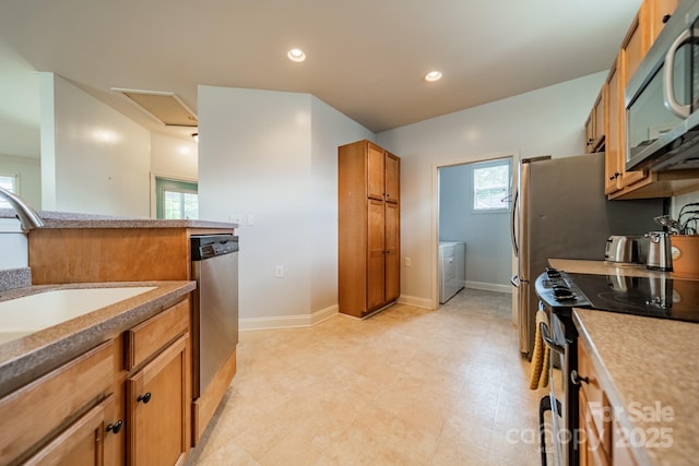 13360 Old Compton Ct, Pineville, NC 28134 - kitchen with recessed lighting, brown cabinetry, stainless steel appliances, a sink, and baseboards