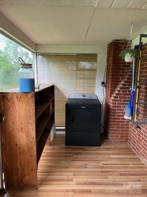 exterior space with brick siding and washer / clothes dryer