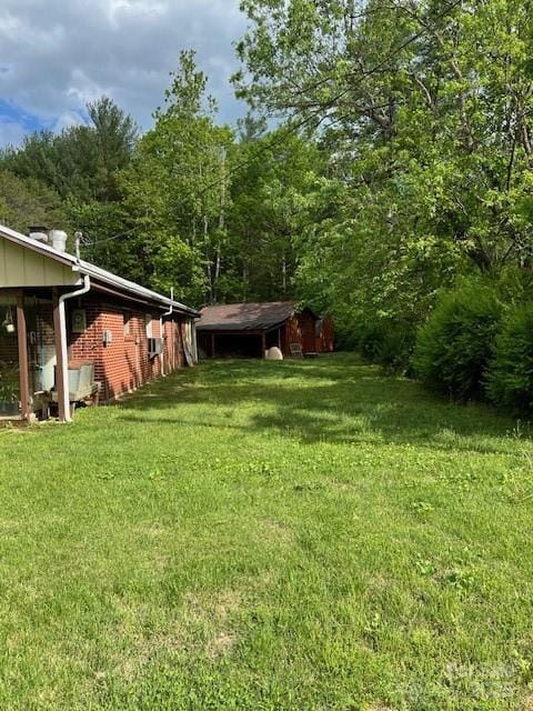 view of yard with a wooded view