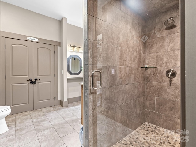 29 Ravenna St, Asheville, NC 28803 - full bath with a shower stall, toilet, and tile patterned floors