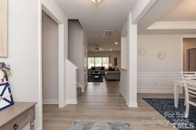 foyer entrance with visible vents, a ceiling fan, light wood finished floors, and recessed lighting