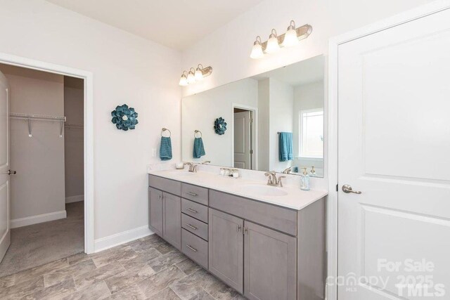 1479 Mocksville Hwy Unit 23, Statesville, NC 28625 - full bath featuring double vanity, baseboards, and a walk in closet