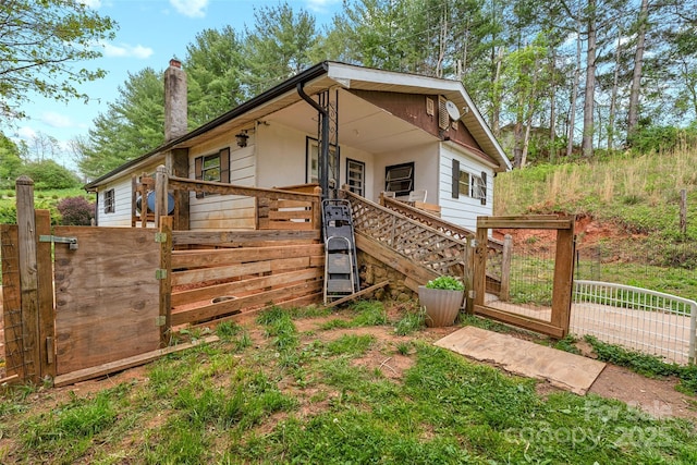 68 Upper White Oak Rd, Mars Hill, NC 28754 - view of front of house with a chimney and a gate