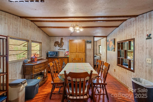 68 Upper White Oak Rd, Mars Hill, NC 28754 - dining room with wooden walls, beamed ceiling, and a chandelier