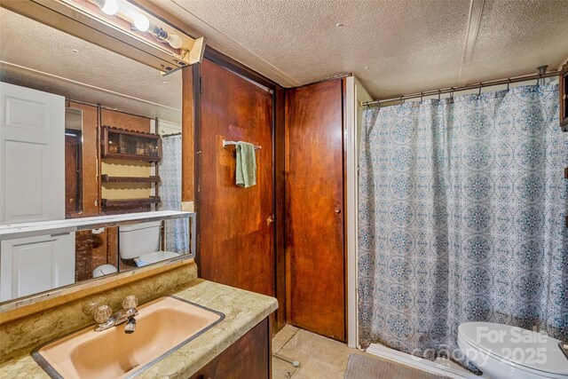 68 Upper White Oak Rd, Mars Hill, NC 28754 - full bathroom with toilet, a textured ceiling, vanity, a shower with curtain, and tile patterned flooring