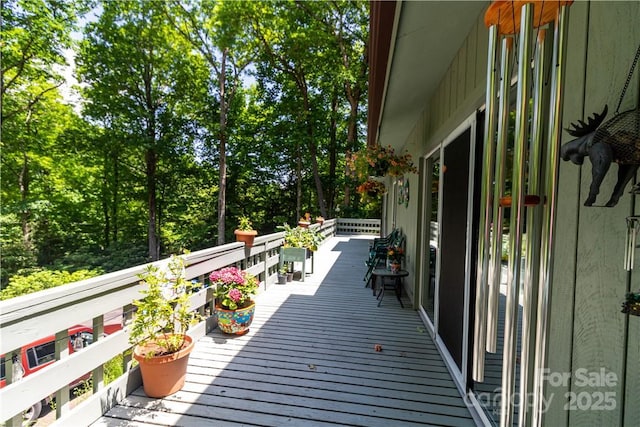 597 Sweetwater Rdg, Burnsville, NC 28714 - wooden deck with view of scattered trees