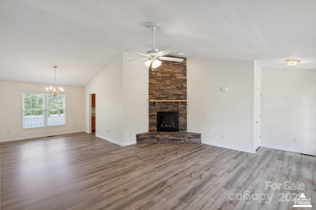 260 Treebark Rd, Statesville, NC 28625 - unfurnished living room featuring wood finished floors, a chandelier, ceiling fan, baseboards, and high vaulted ceiling