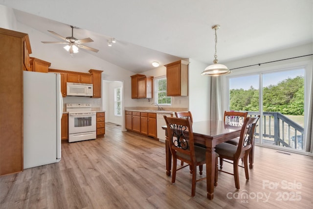260 Treebark Rd, Statesville, NC 28625 - dining room with light wood-type flooring, vaulted ceiling, and ceiling fan