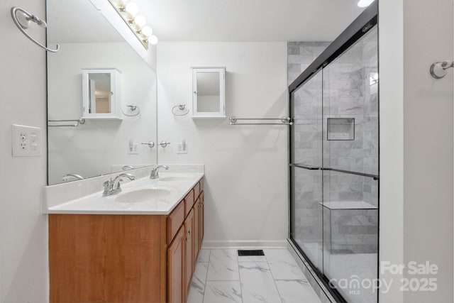 260 Treebark Rd, Statesville, NC 28625 - bathroom with marble finish floors, a stall shower, baseboards, and double vanity