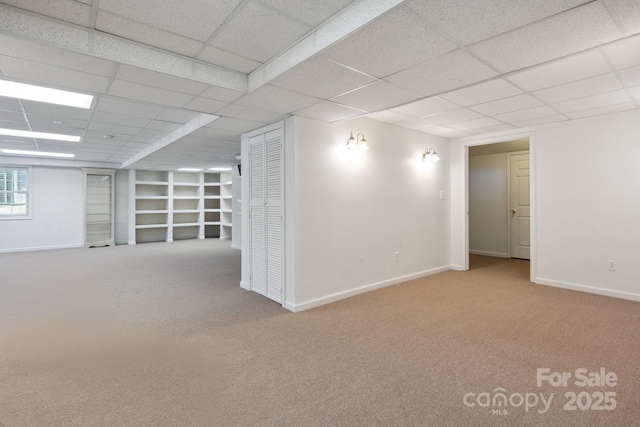 260 Treebark Rd, Statesville, NC 28625 - basement with a paneled ceiling, baseboards, carpet floors, and built in shelves