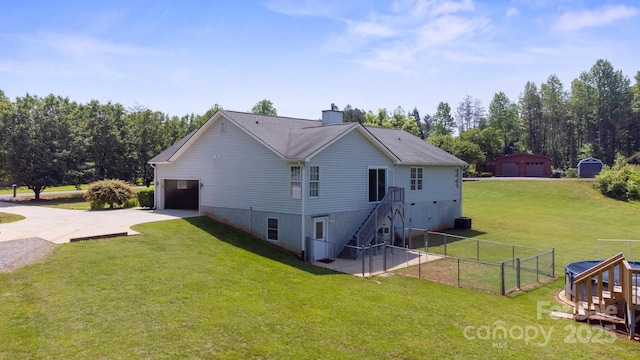 260 Treebark Rd, Statesville, NC 28625 - view of side of home featuring driveway, a chimney, and a garage
