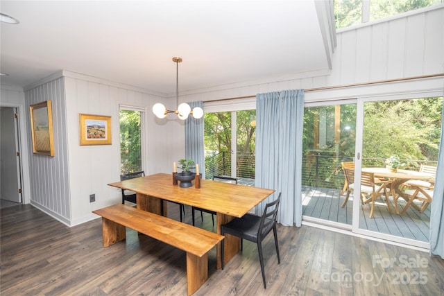 dining space with wood finished floors and plenty of natural light