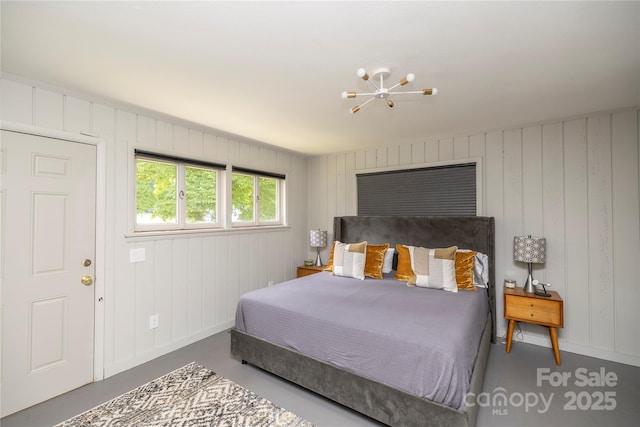 bedroom with a chandelier