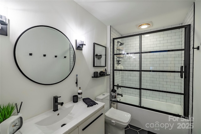 full bath with toilet, enclosed tub / shower combo, and vanity
