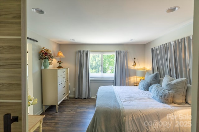 bedroom featuring recessed lighting, dark wood-style floors, and baseboards
