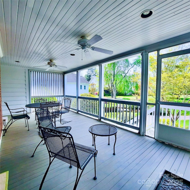 exterior space with ceiling fan and outdoor dining space