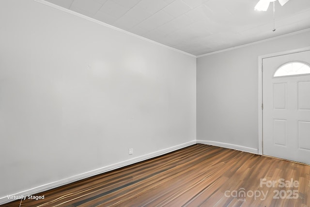 foyer entrance featuring ornamental molding, ceiling fan, baseboards, and dark wood-type flooring