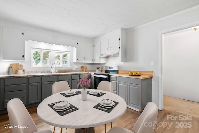 kitchen featuring white cabinetry, electric stove, gray cabinets, and under cabinet range hood