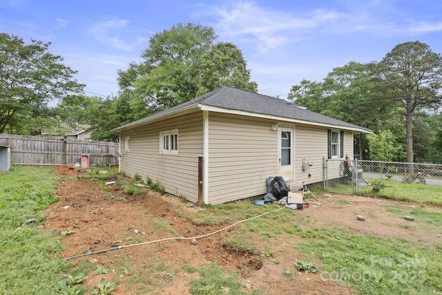 view of property exterior with a fenced backyard