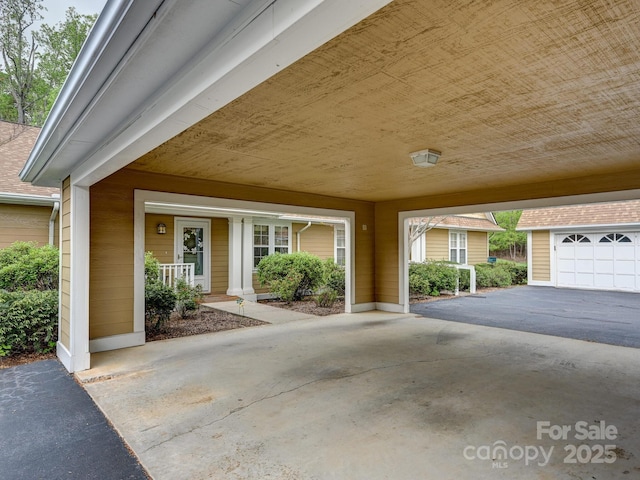 doorway to property featuring a carport