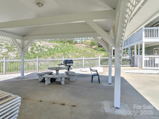 view of patio / terrace featuring fence