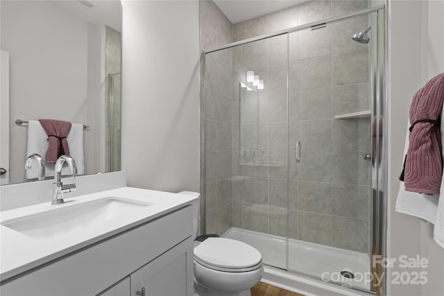 1287 Fishing Creek Rd, Lake Wylie, SC 29710 - bathroom featuring vanity, a shower stall, toilet, and wood finished floors